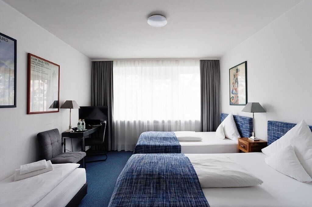 Triple Room, City View | Hypo-allergenic bedding, down comforters, Select Comfort beds