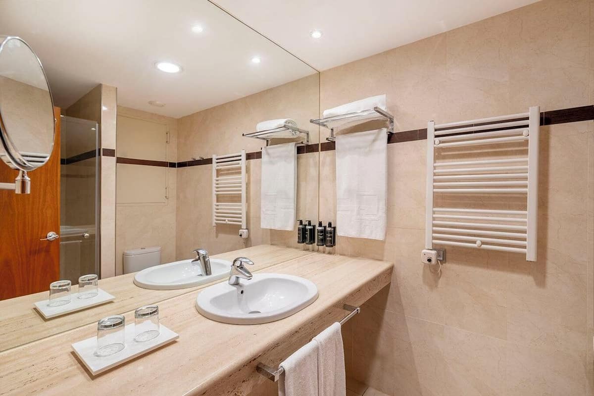 eco-friendly toiletries, hair dryer, towels, soap