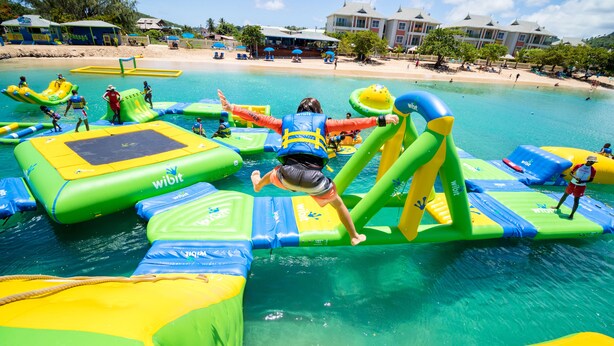 An inflatable water park with various play structures and slides. - Bay Gardens Hotel (Gros Islet)