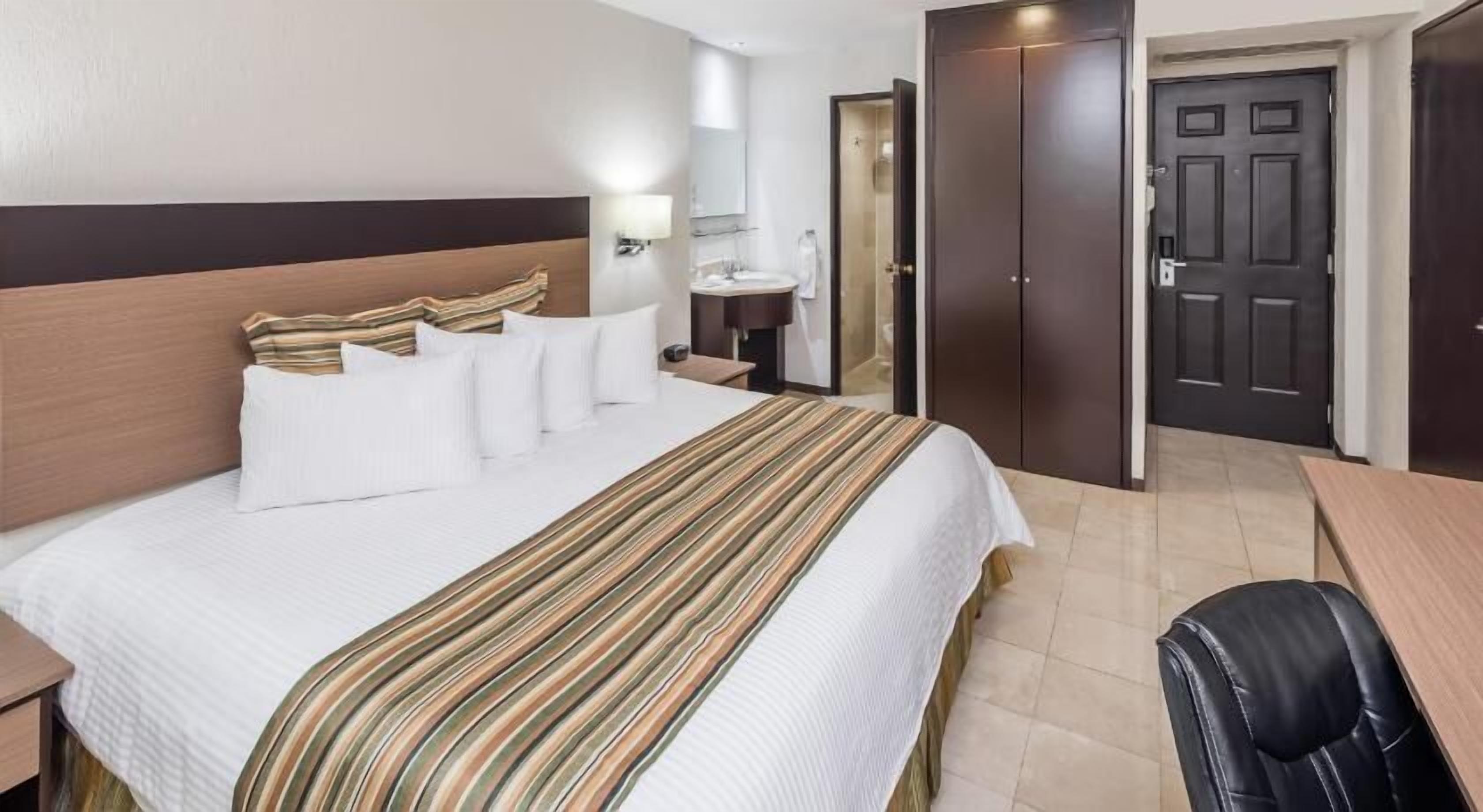 Edredón, camas con pillow-top y caja de seguridad en la habitación 