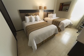 Down duvets, pillow-top beds, in-room safe, desk
