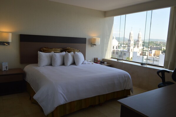 Down duvets, pillow-top beds, in-room safe, desk