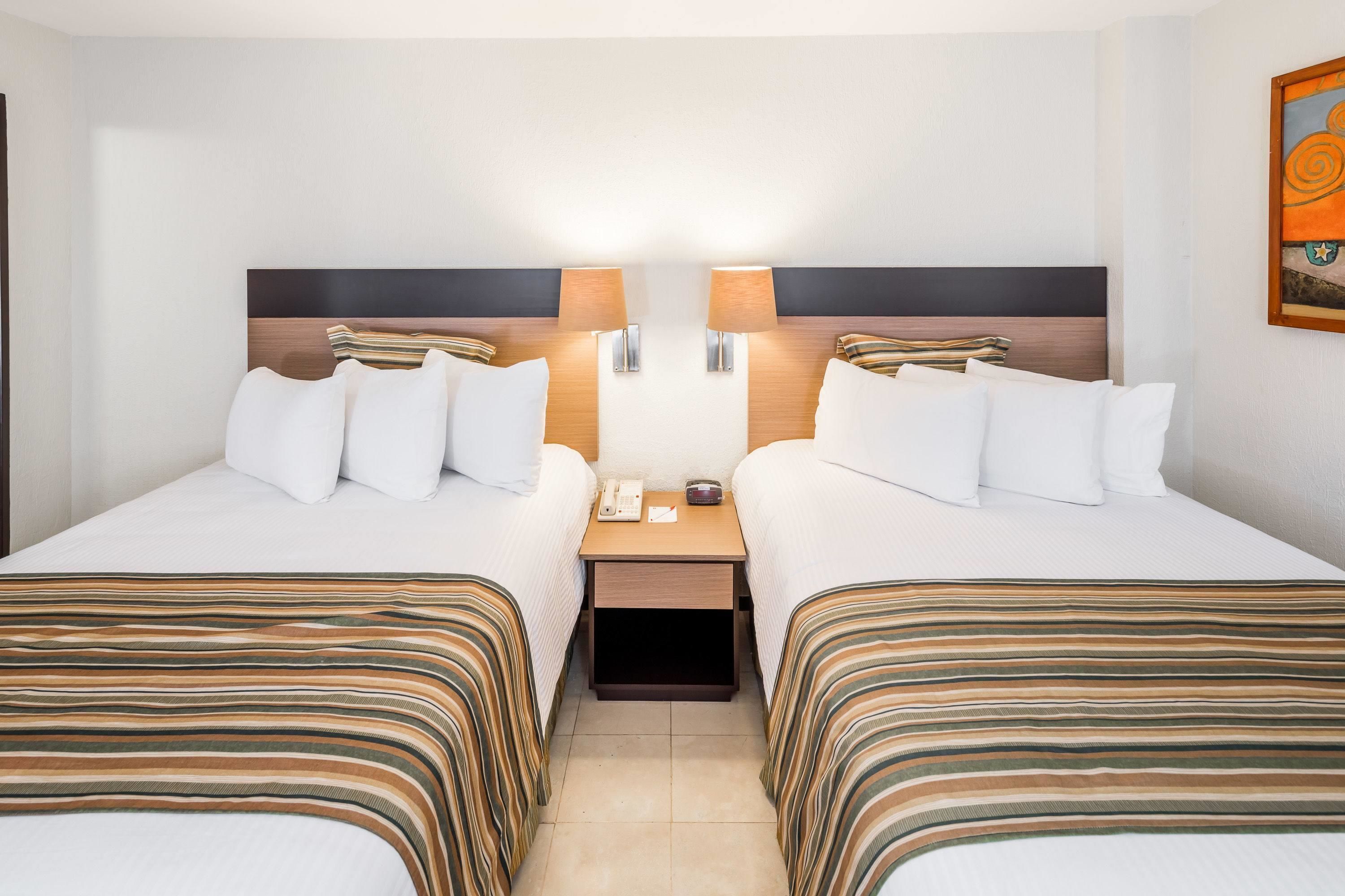 Down comforters, pillowtop beds, in-room safe, desk