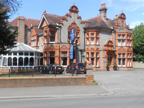 A historic building with ornate brickwork and multiple chimneys. - Sure Hotel by Best Western Reading (Reading)