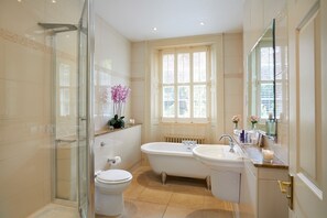 Separate bathtub and shower, designer toiletries, hair dryer, towels