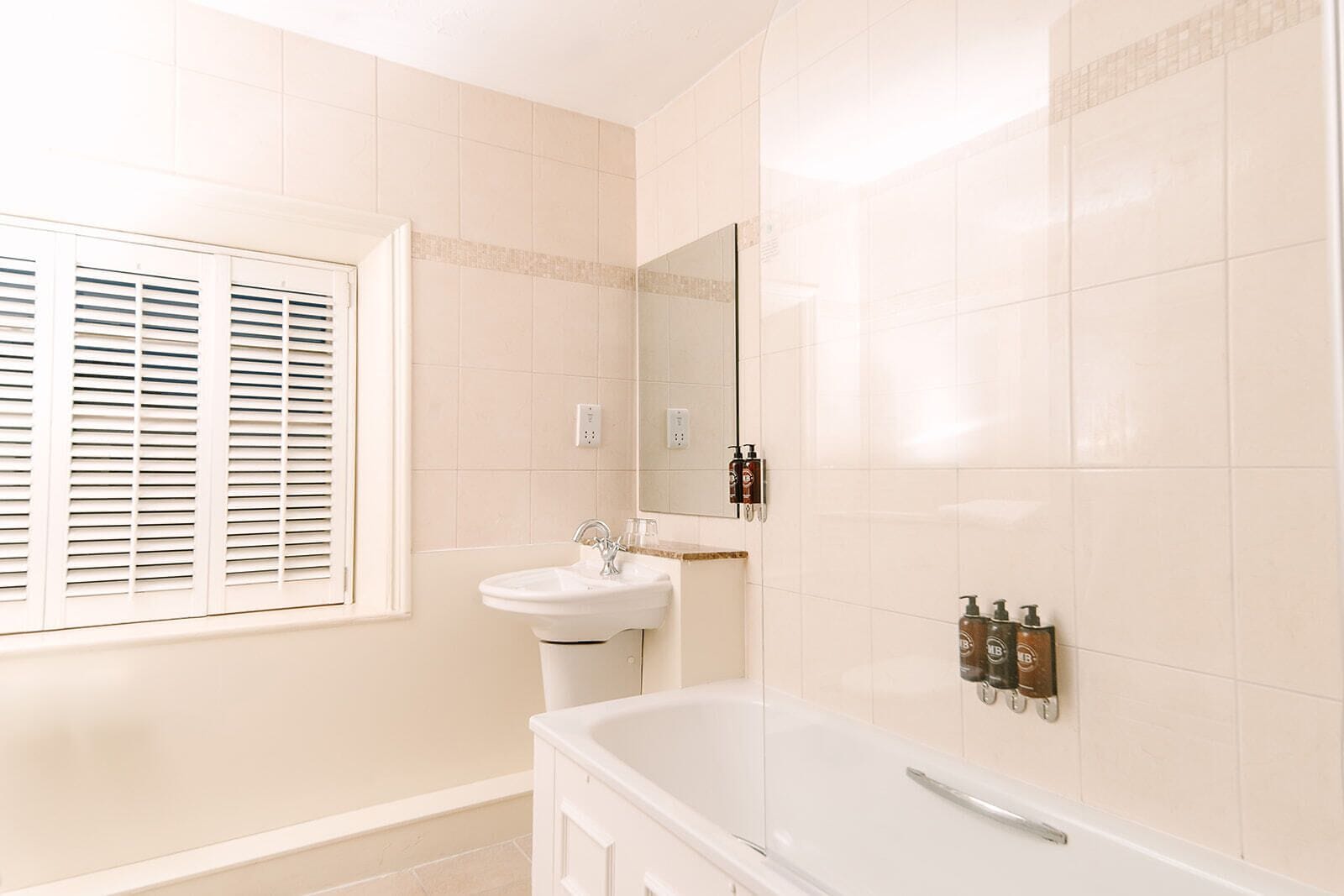 mansion house luxe | bathroom | separate bathtub and shower, designer toiletries, hair dryer, towels