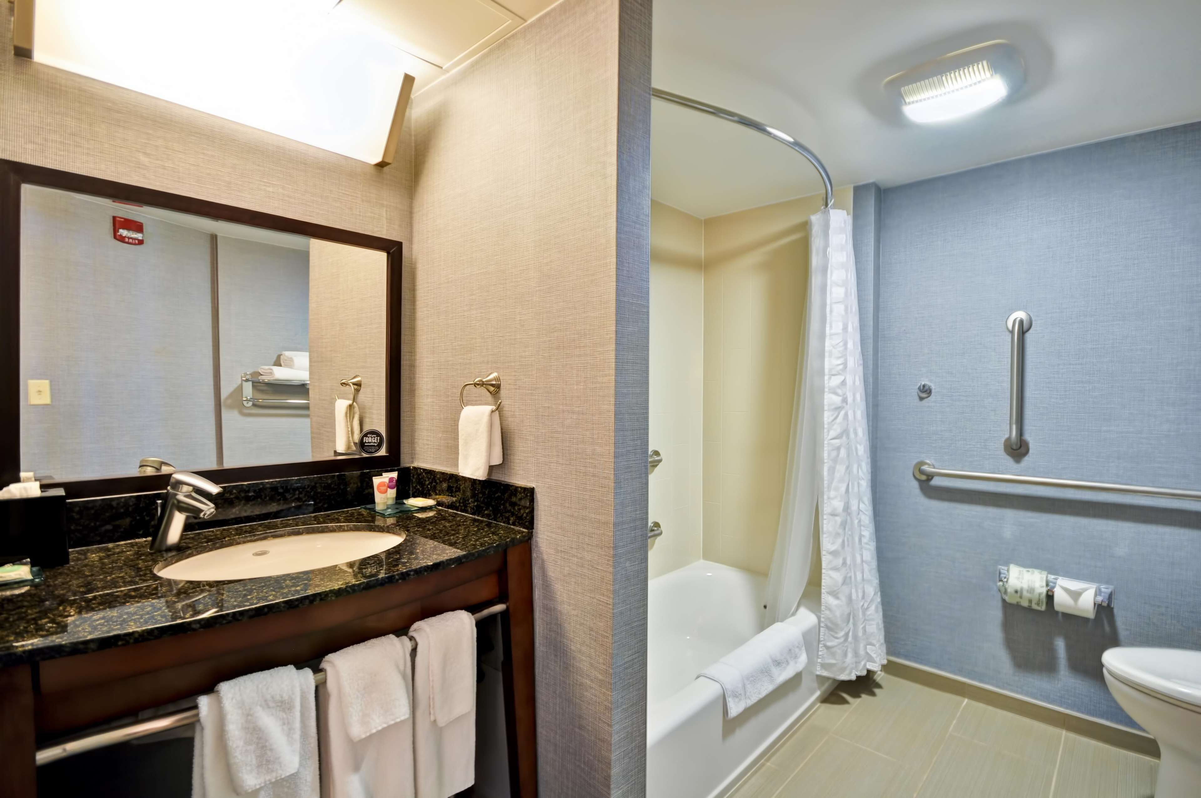 designer toiletries, hair dryer, towels