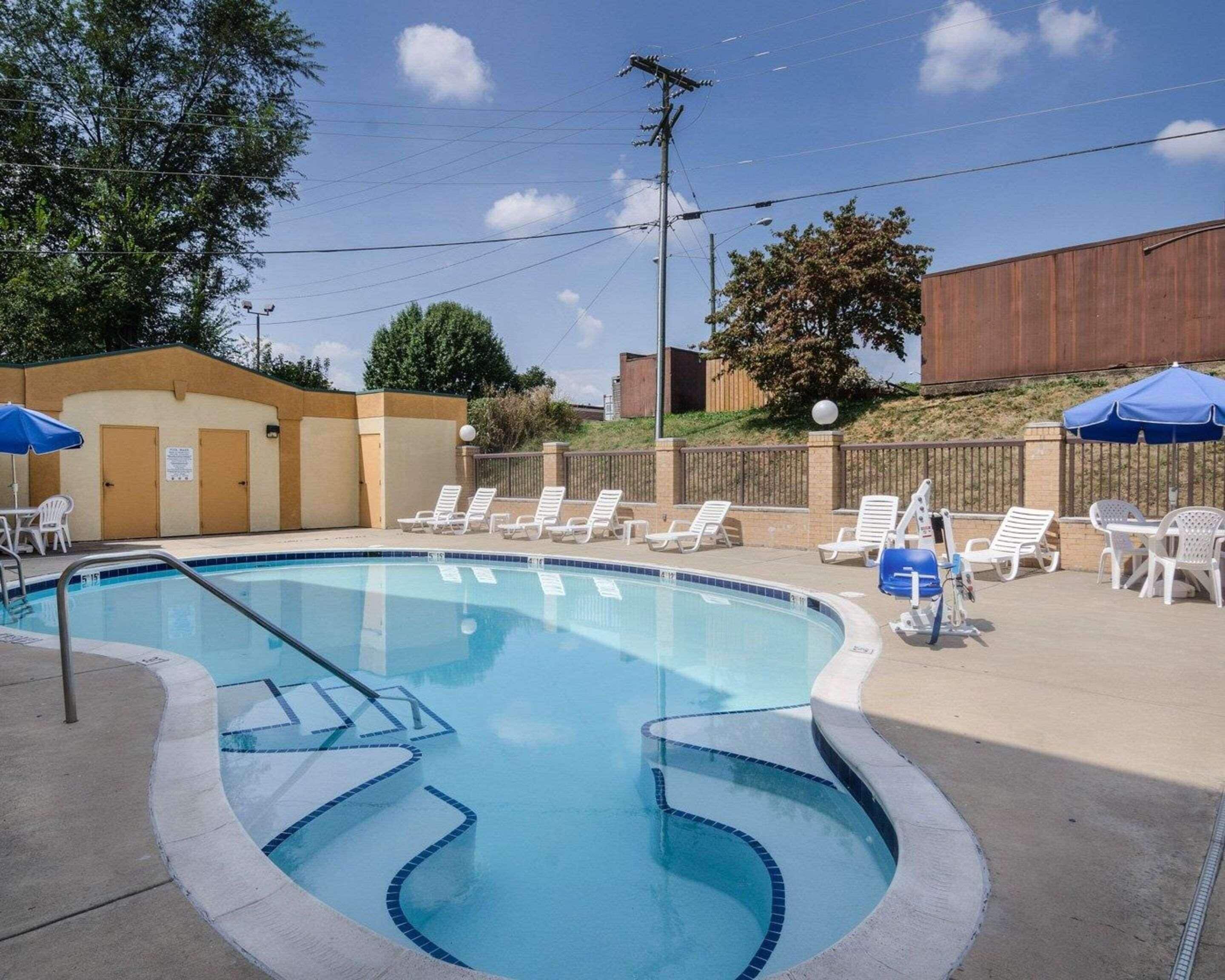 Seasonal outdoor pool, open 9:00 AM to 10:00 PM, pool umbrellas