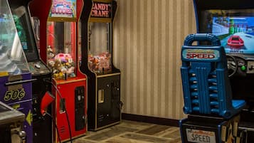 Experience the nostalgia of classic arcade games in this retro-themed space, featuring vintage machines like California Speed and Candy Land.