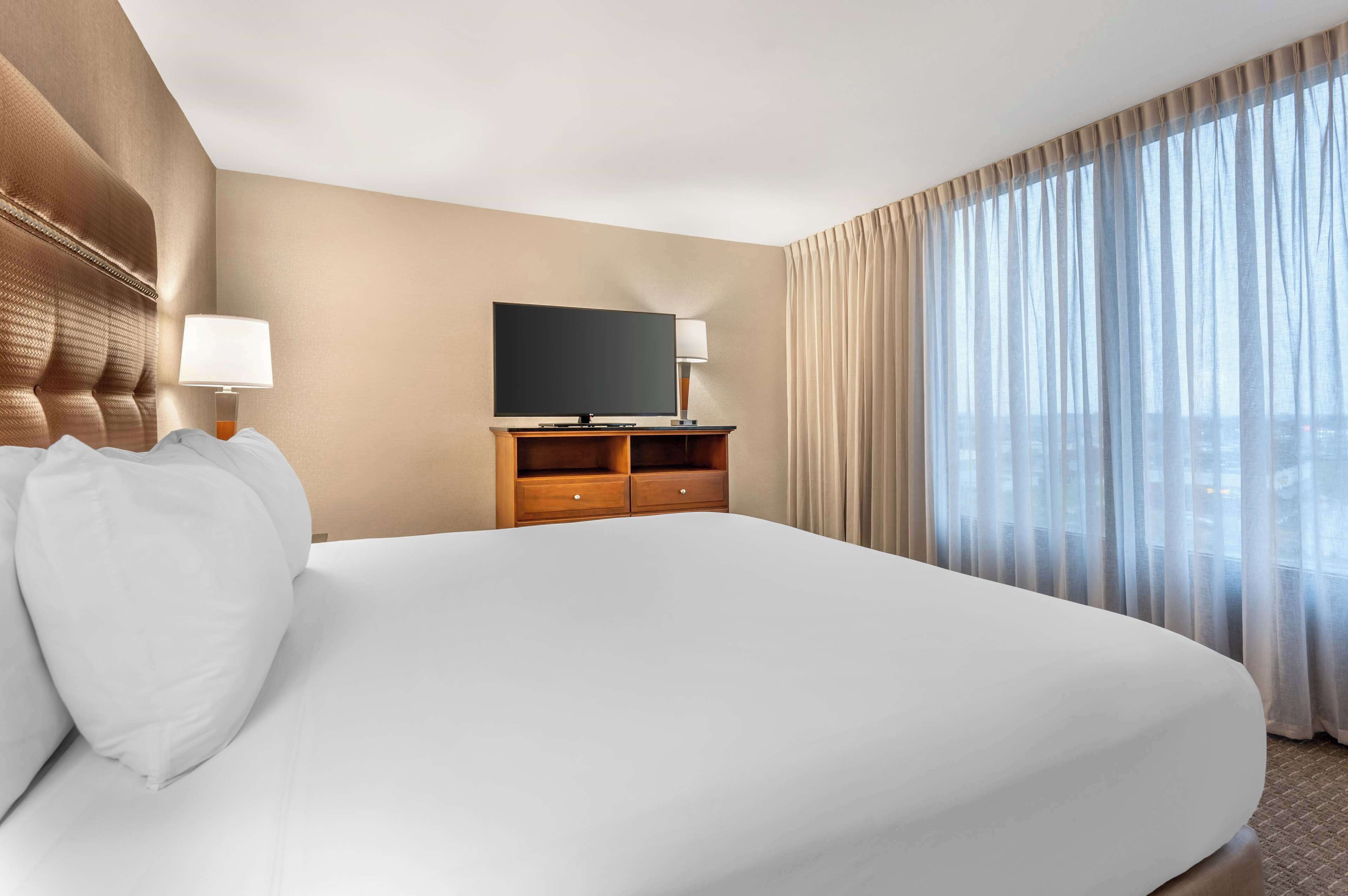 desk, laptop workspace, blackout curtains, iron/ironing board