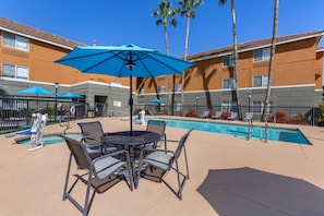 Outdoor pool, open 7 AM to 10 PM, pool umbrellas, pool loungers