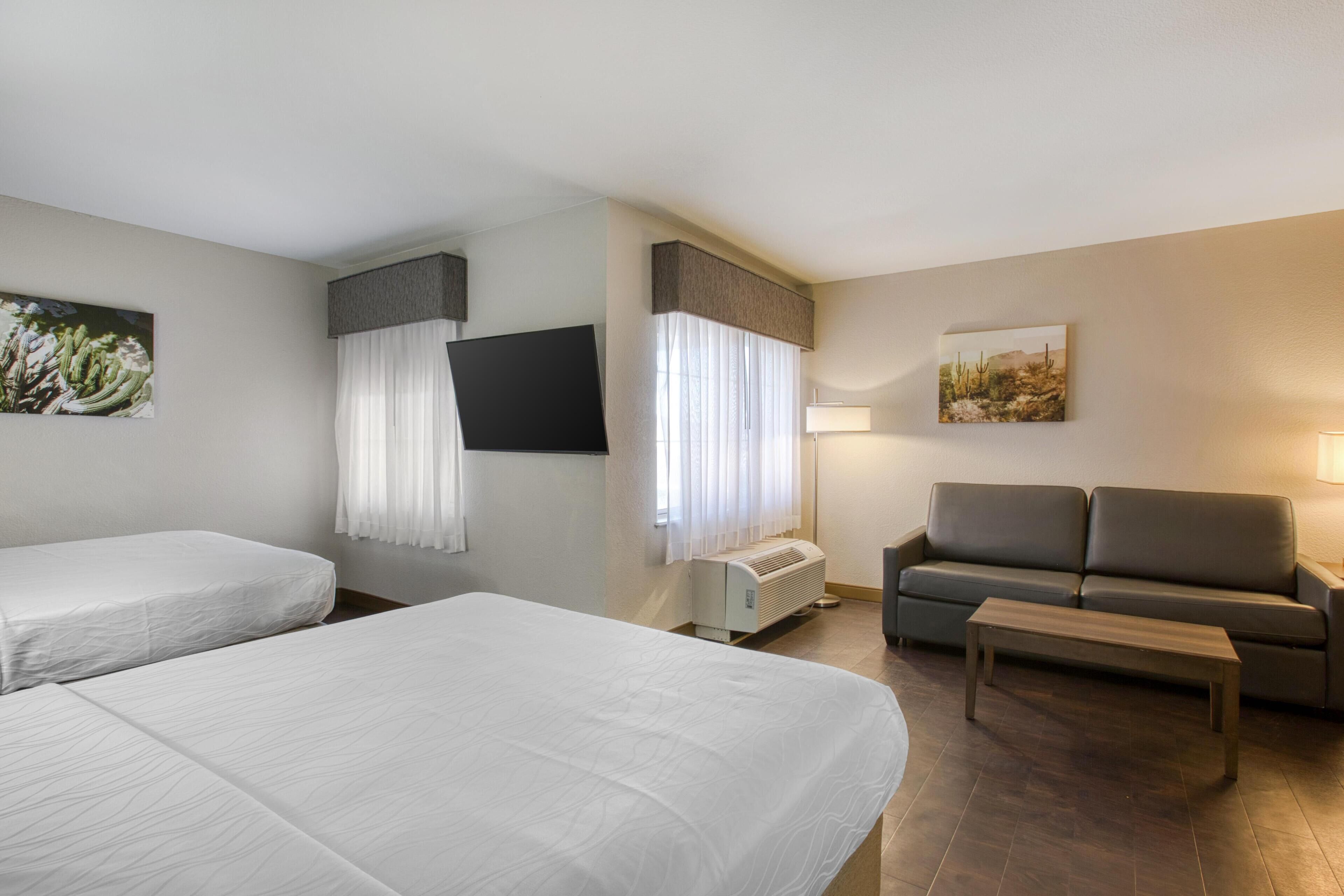 Laptop workspace, blackout drapes, iron/ironing board, bed sheets