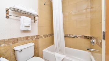 A bathroom with a toilet, bathtub, shower curtain, and towel rack.