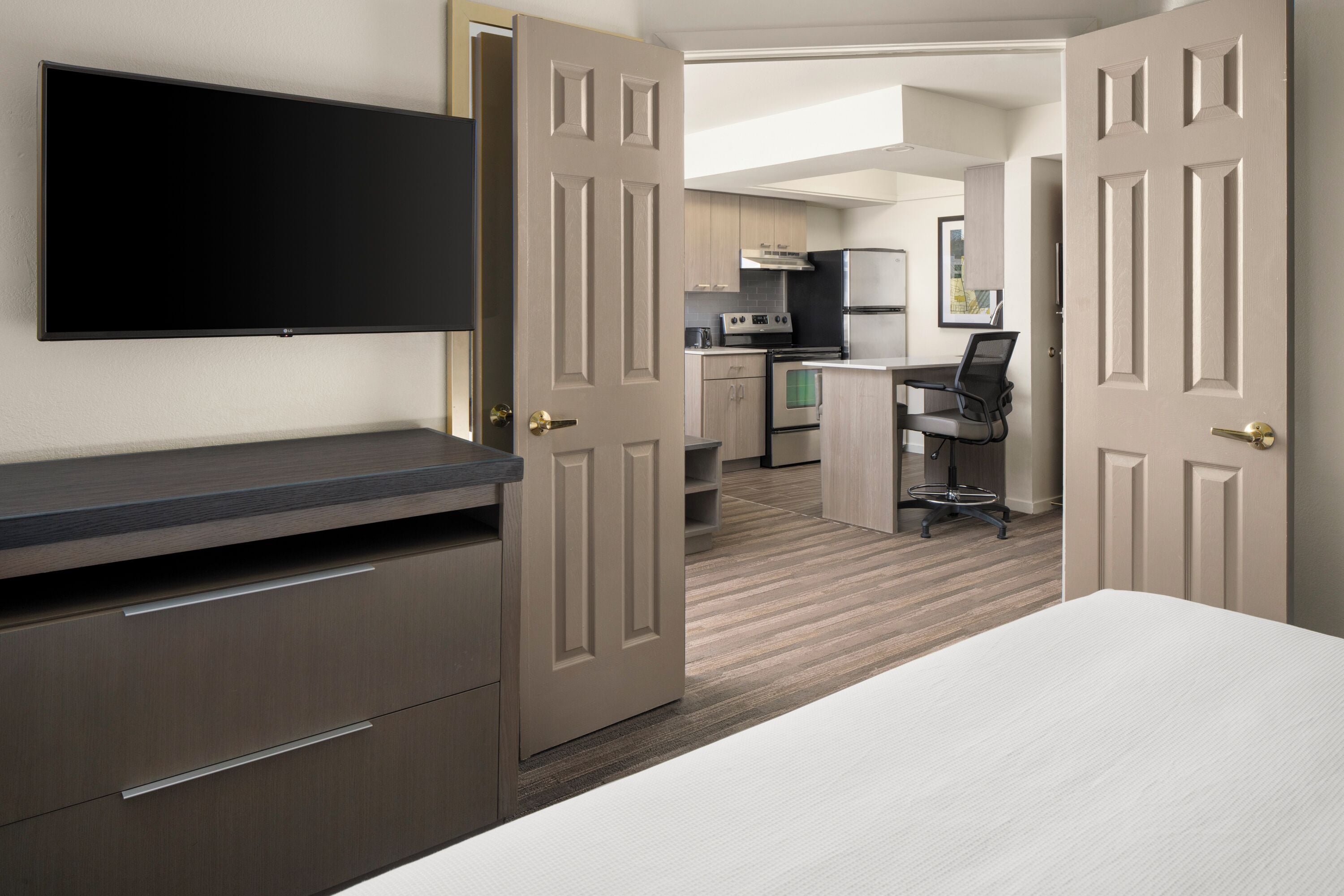 premium bedding, pillow-top beds, laptop workspace, iron/ironing board