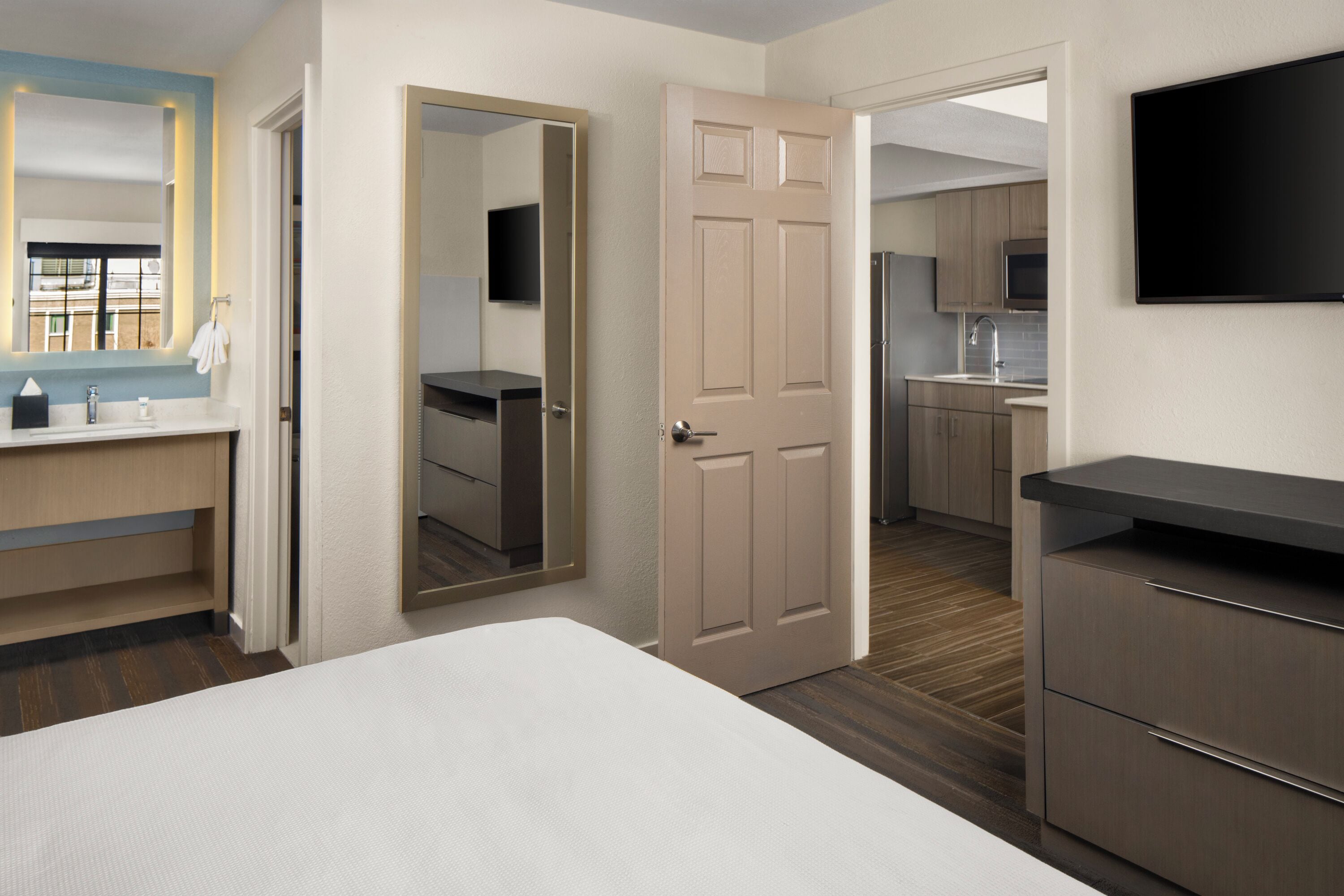 premium bedding, pillow-top beds, laptop workspace, iron/ironing board