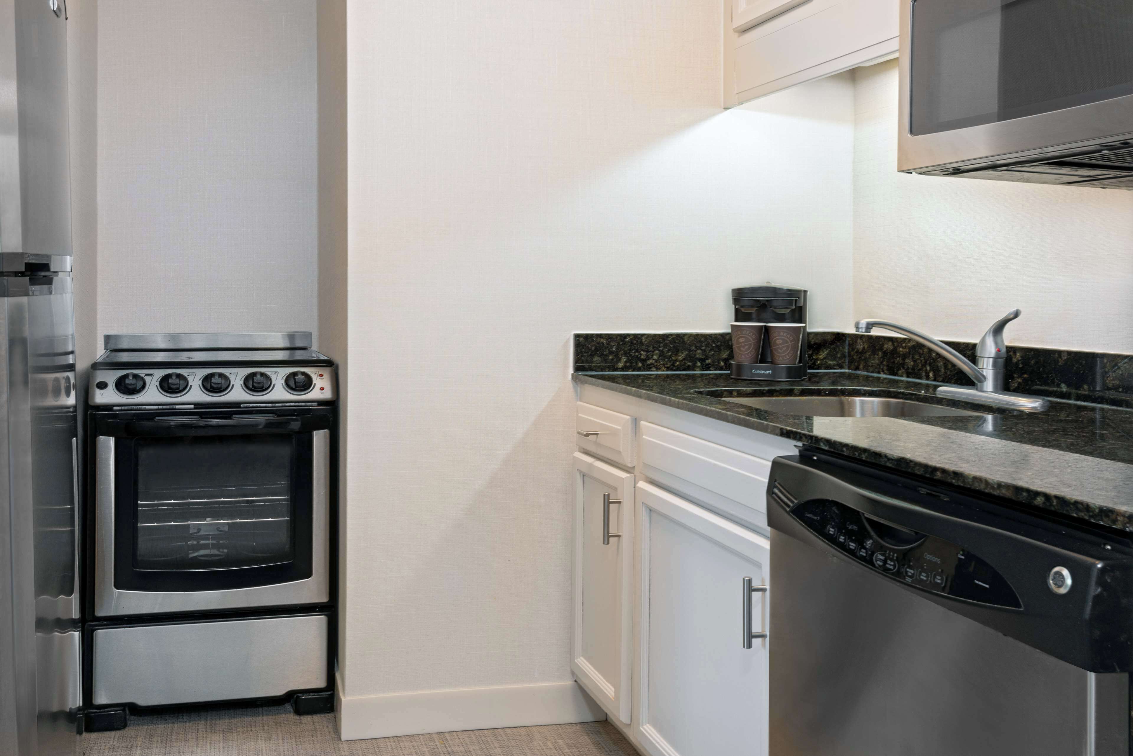 suite, 2 bedrooms, non smoking (1 king/2 doubles) | private kitchen | fridge, microwave, stovetop, dishwasher