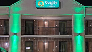 A hotel with a sign reading "Quality Inn by Choice Hotels." - Quality Inn Henderson I-85 (Henderson)
