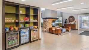 A hotel lobby with a snack bar, seating area, and a stone fireplace. - Best Western Plus Wenatchee Downtown Hotel (Wenatchee)