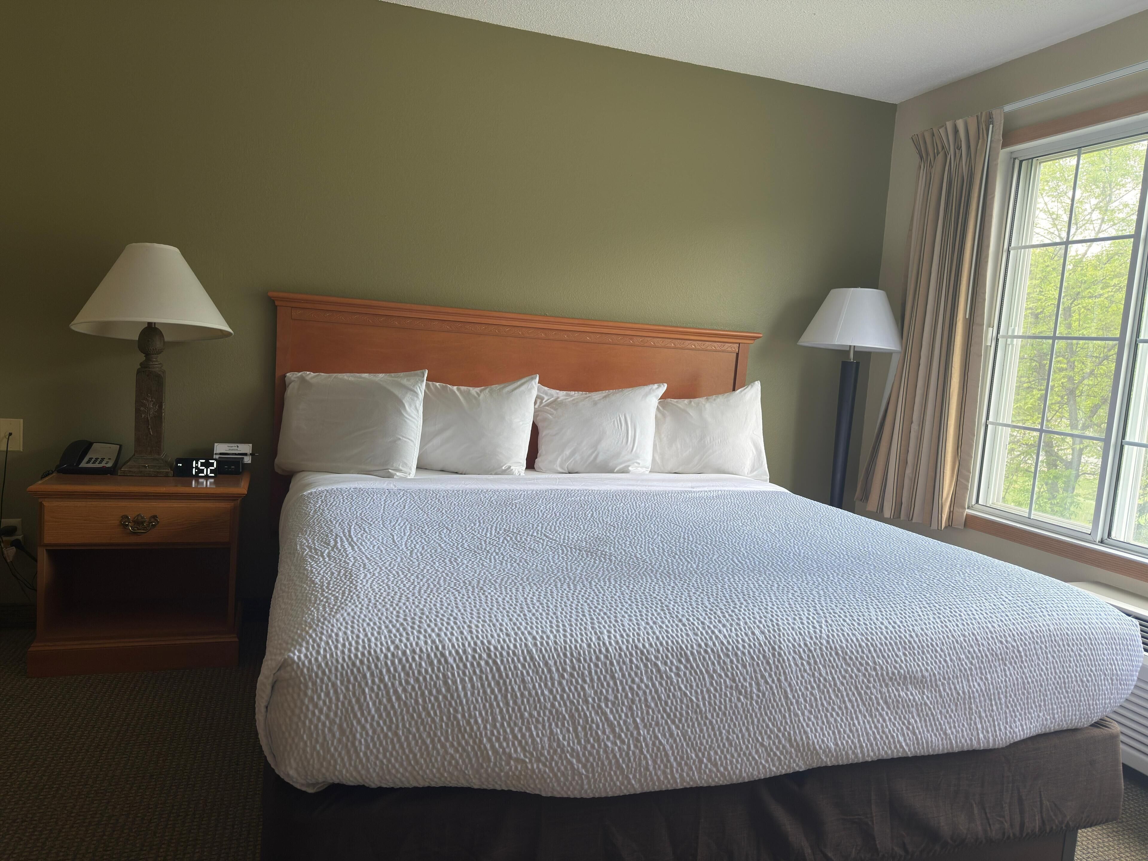 1 king suite with sofa bed | premium bedding, individually furnished, laptop workspace