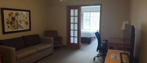 1 King Suite with Sofa bed | Living area | 0-inch flat-screen TV with cable channels, TV