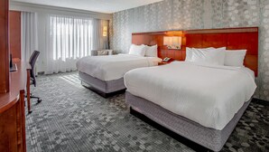 A hotel room with two beds, a desk, and a chair. - Courtyard by Marriott Gulf Shores Craft Farms (Gulf Shores)