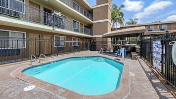 Outdoor pool, open 9:00 AM to 10:00 PM, pool umbrellas, pool loungers