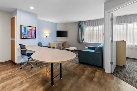 Hypo-allergenic bedding, desk, laptop workspace, blackout curtains. MainStay Suites Cincinnati Blue Ash