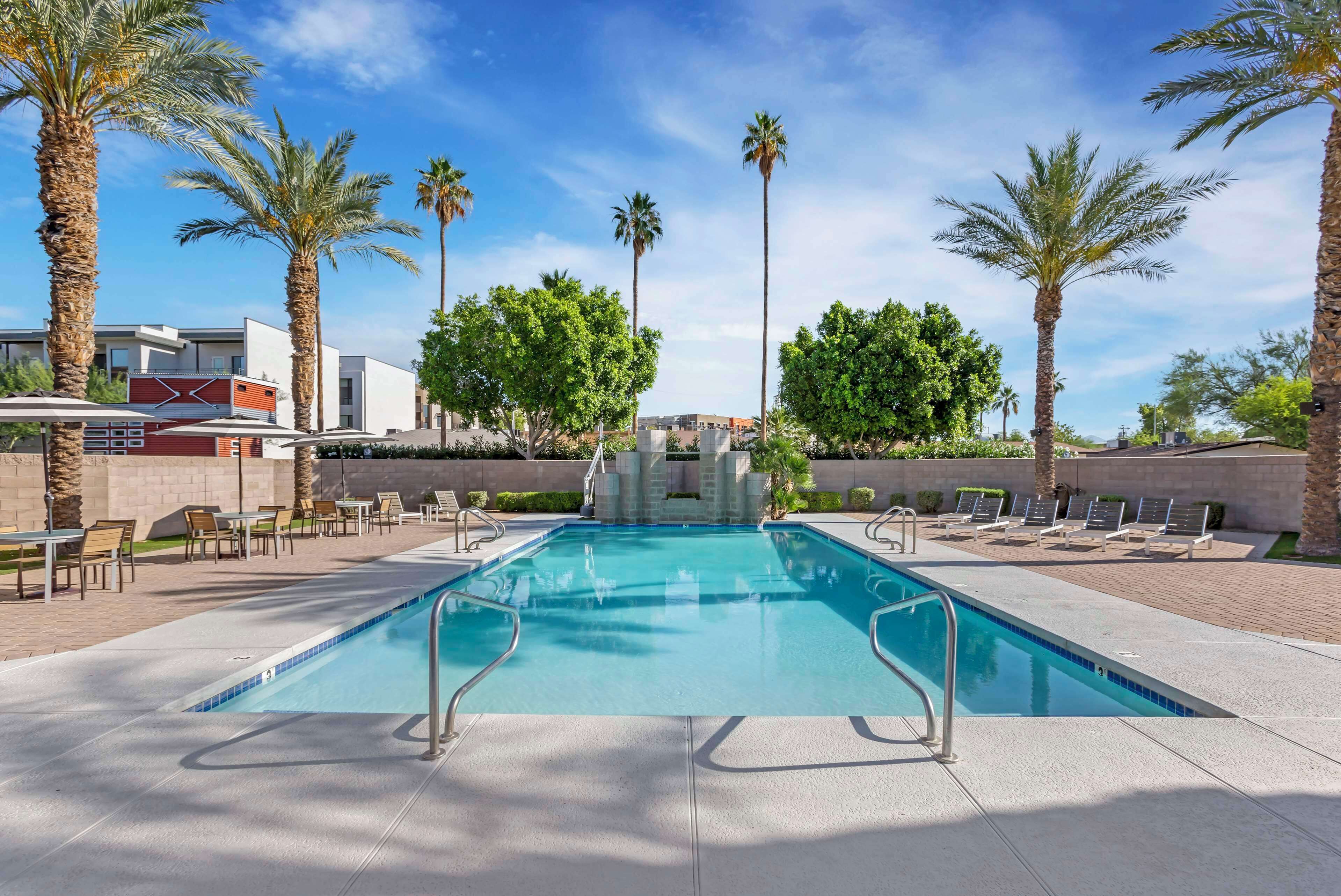 outdoor pool, open 8 am to 8 pm, pool loungers