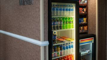 A vending machine stocked with various beverages and snacks, including Pepsi, Aquafina, and Doritos.