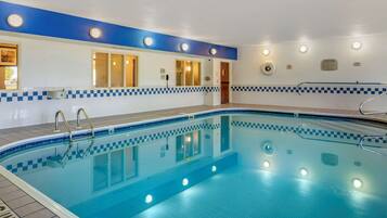 Swimmers can enjoy a refreshing dip in this rectangular pool surrounded by a tiled deck.