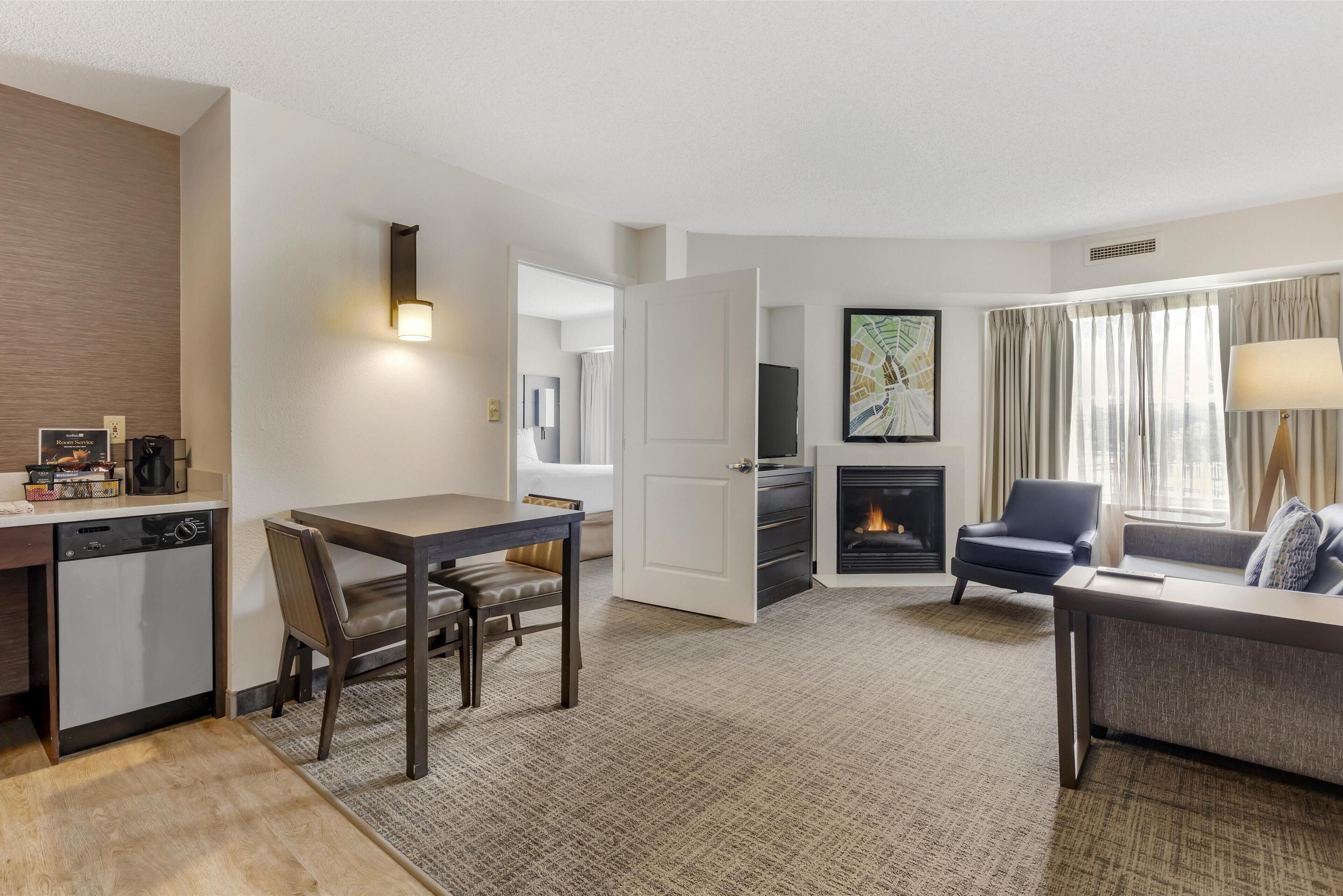 Desk, laptop workspace, blackout drapes, iron/ironing board