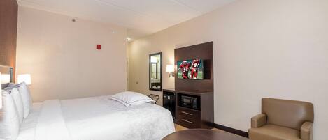 Desk, laptop workspace, blackout drapes, iron/ironing board