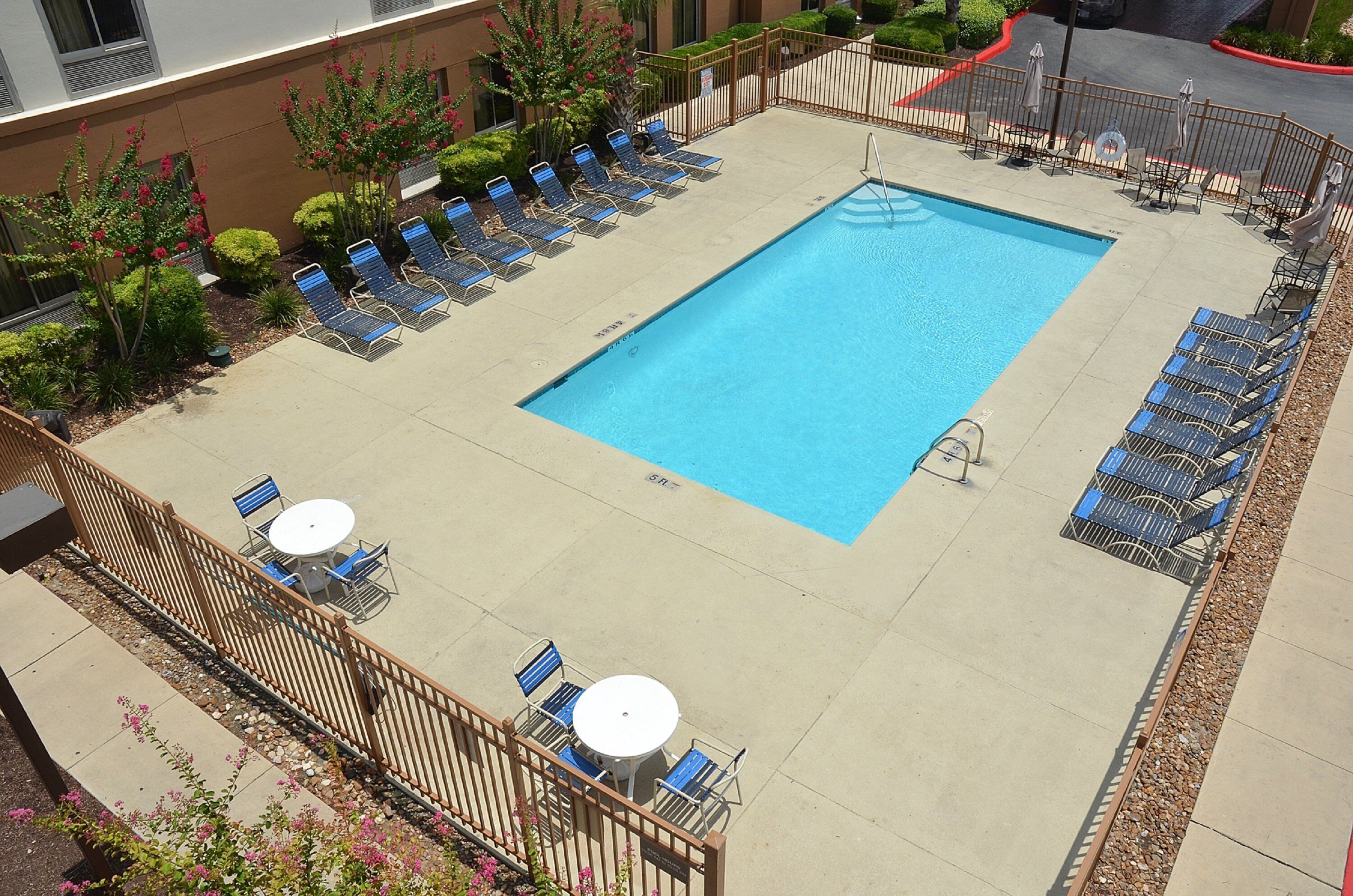 Seasonal outdoor pool, open 9:00 AM to 10:00 PM, pool umbrellas
