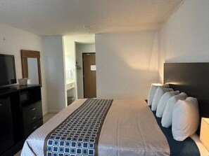 Desk, laptop workspace, blackout drapes, iron/ironing board