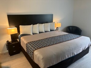 Desk, laptop workspace, blackout drapes, iron/ironing board