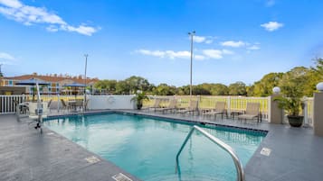 Outdoor pool, open 9:00 AM to 9:00 PM, pool umbrellas, pool loungers