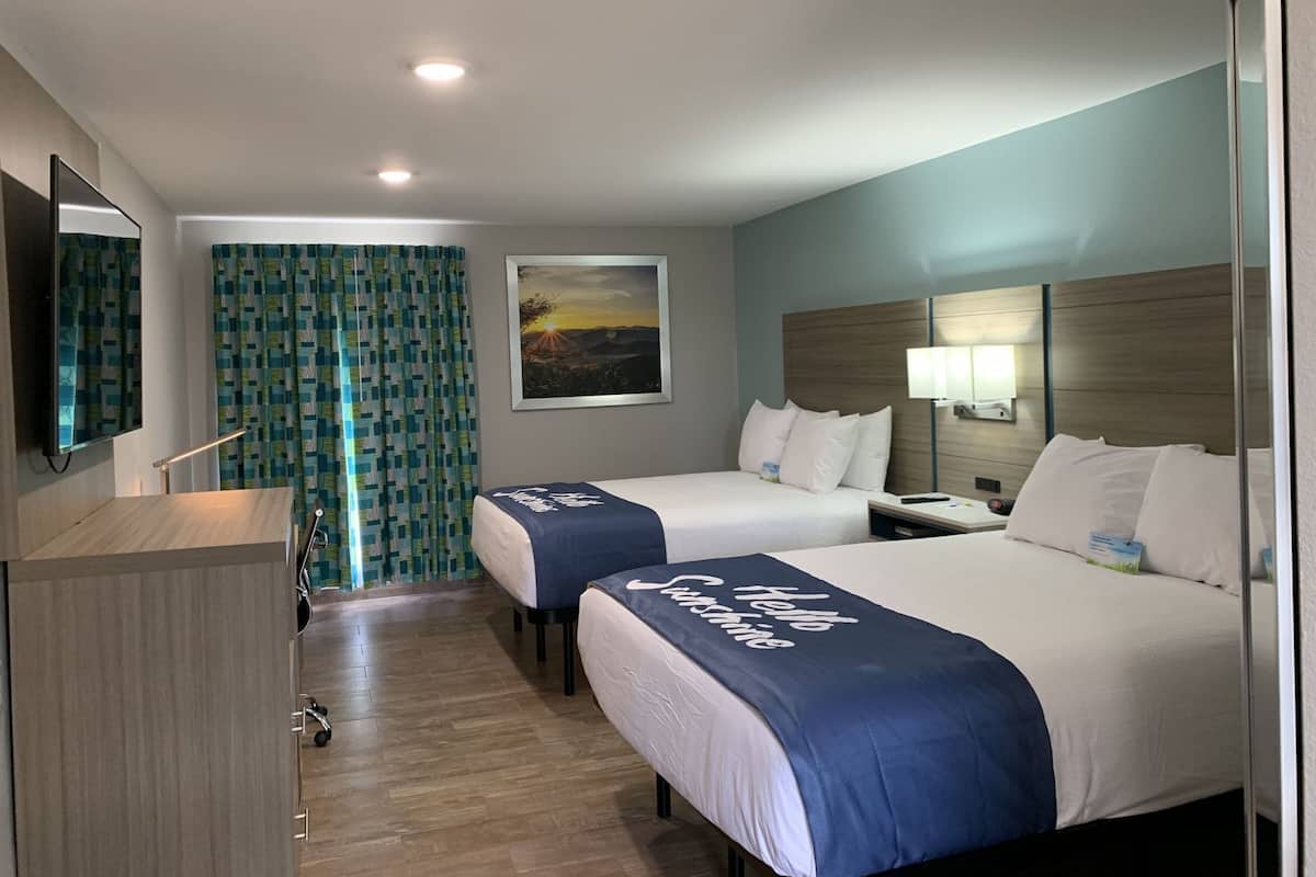 Down comforters, desk, blackout drapes, iron/ironing board