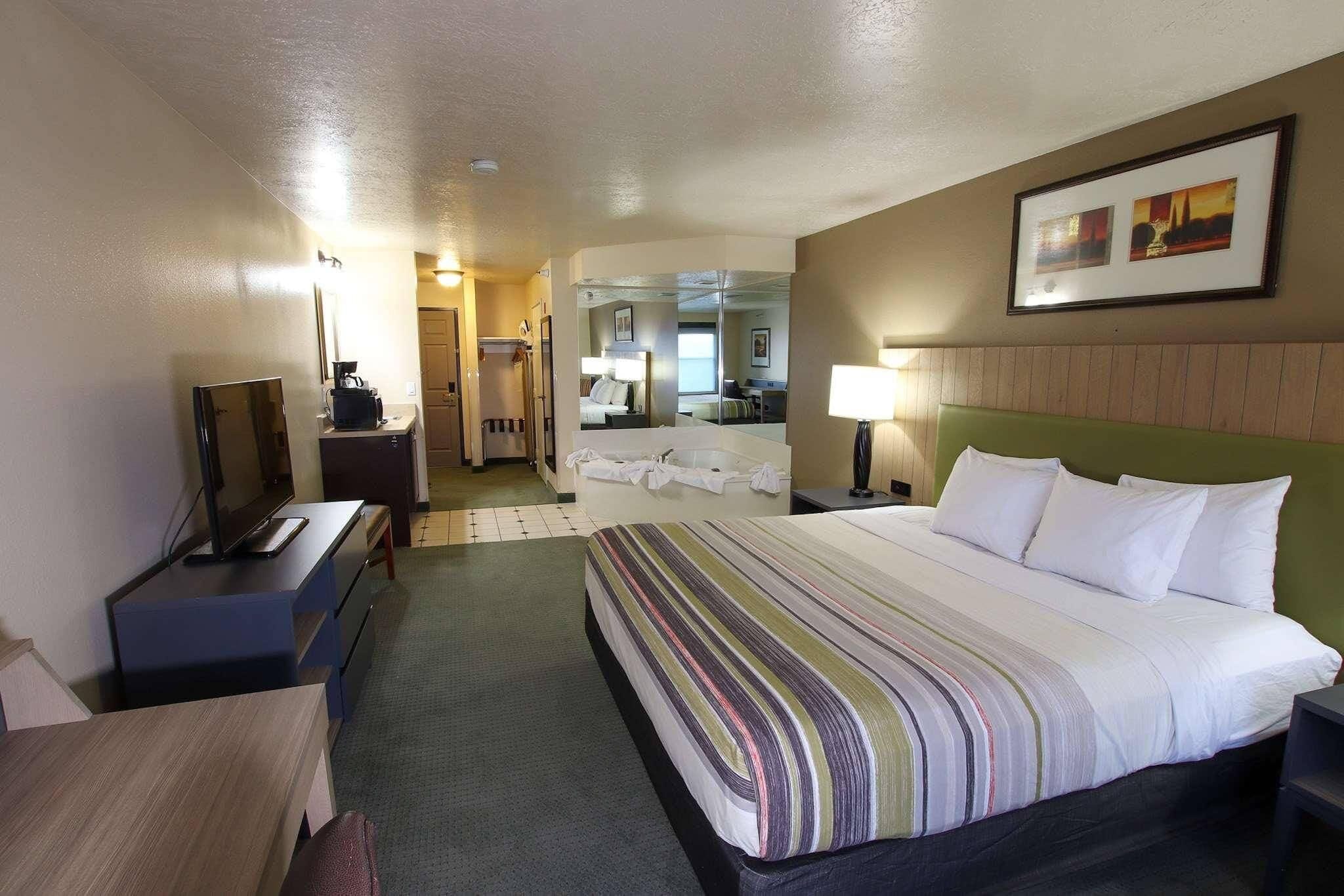 Suite, 1 King Bed, Non Smoking, Jetted Tub | Egyptian cotton sheets, premium bedding, down comforters, pillowtop beds