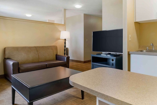 Desk, laptop workspace, blackout drapes, iron/ironing board