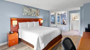 Chambre, 1 très grand lit, baignoire à jets | Bureau, accès au Wi-Fi (inclus), literie fournie, réveille-matin