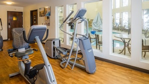 A fitness center with cardio machines, a pool view, and a wooden floor. - Comfort Inn & Suites Spokane Valley Central (Spokane Valley)