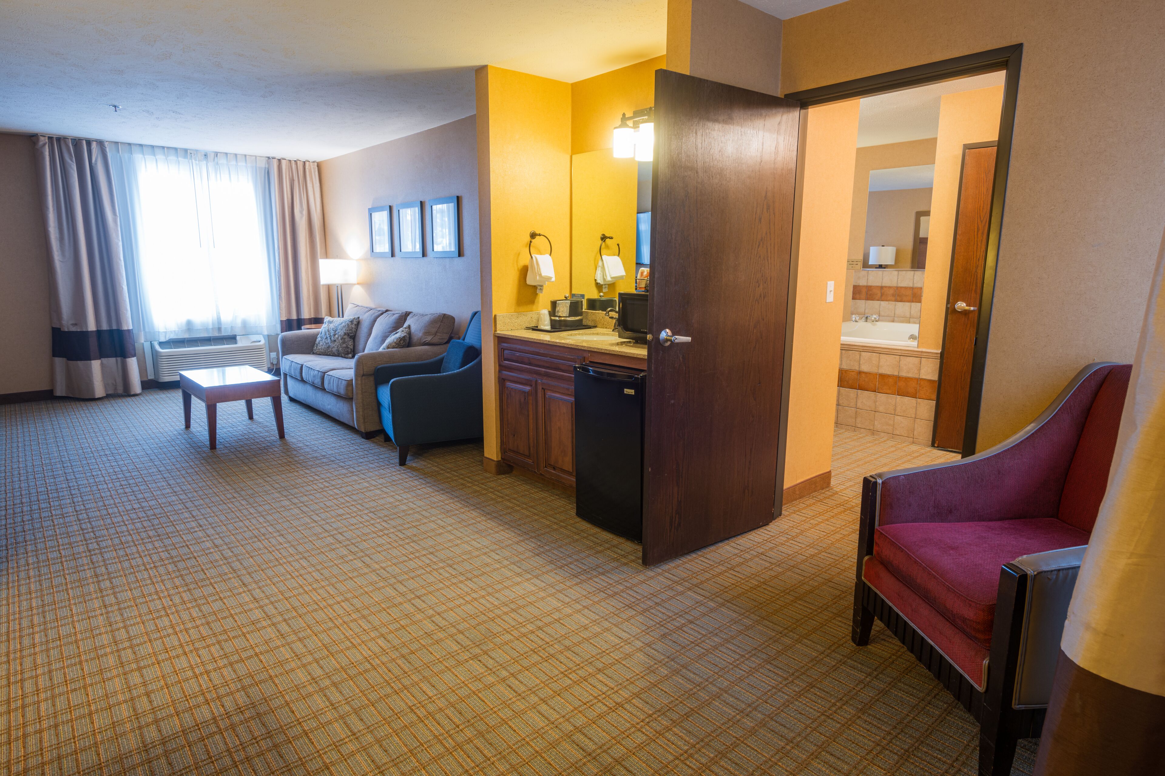 suite, 1 king bed, non smoking (upgrade) | living area | 55-inch flat-screen tv with cable channels, tv