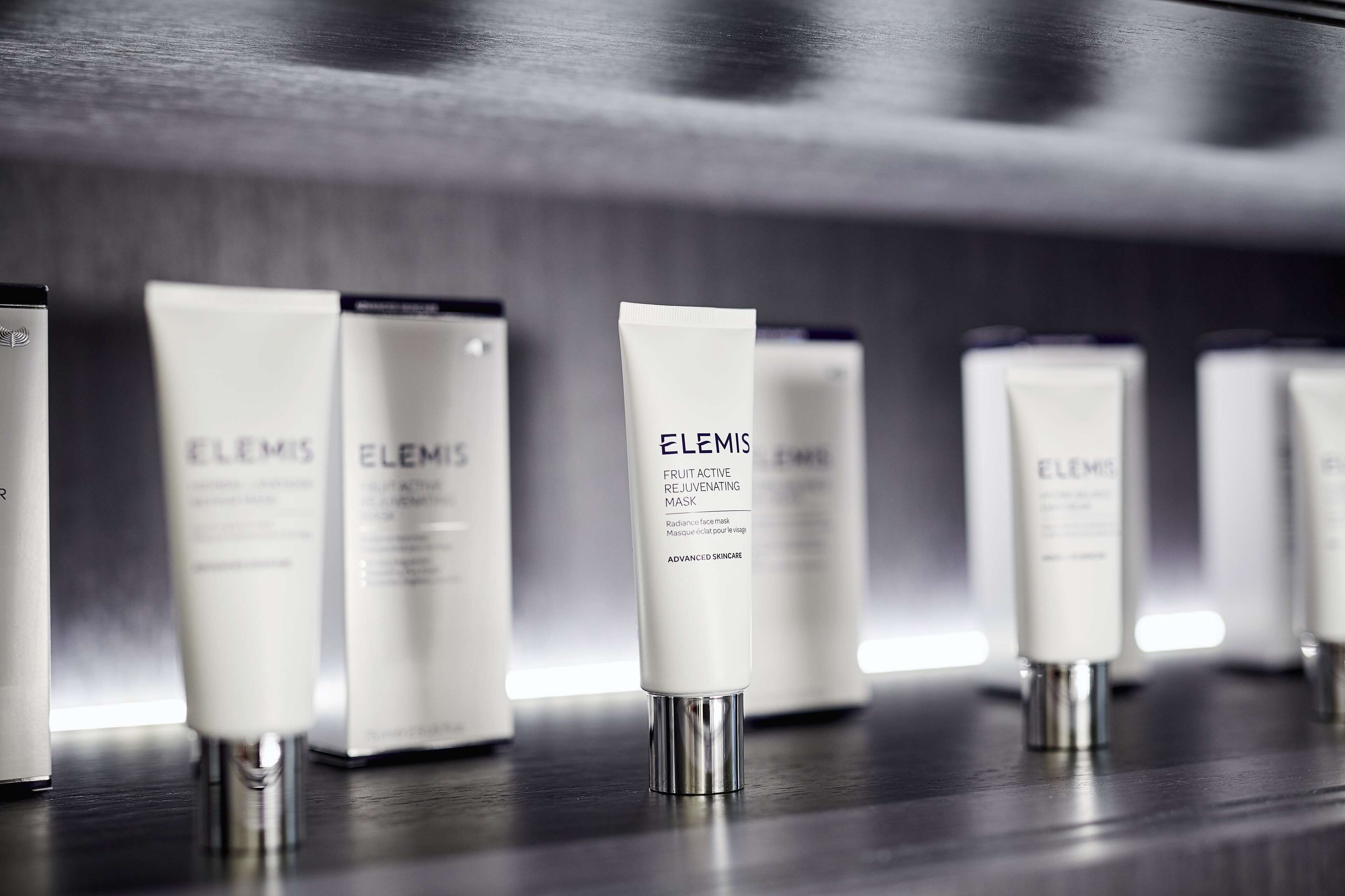 A row of Elemis skincare products on a shelf.