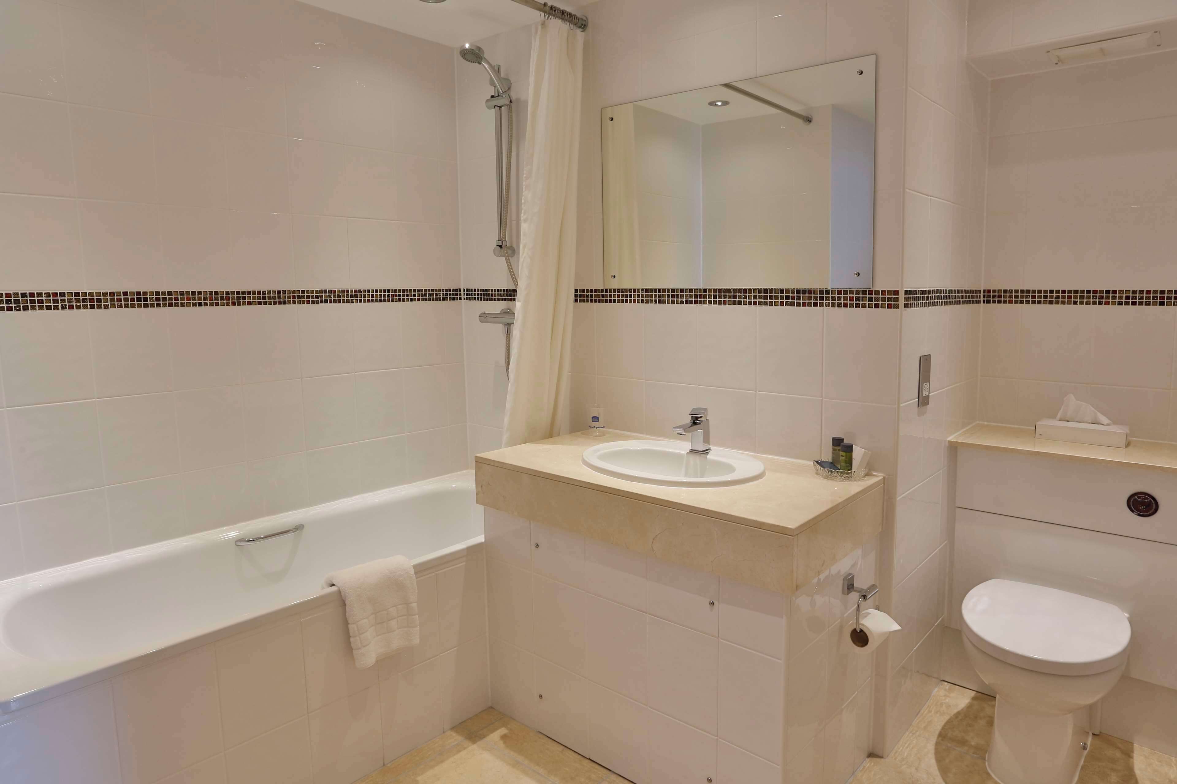 comfort room, multiple beds, non smoking | bathroom | combined shower/bathtub, free toiletries, hair dryer, towels