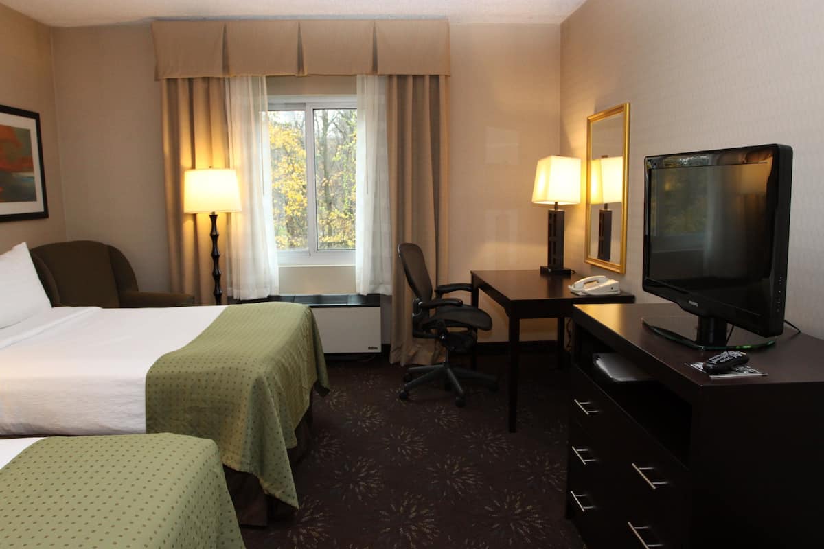 Hypo-allergenic bedding, desk, laptop workspace, blackout curtains