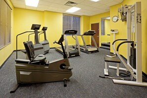 A fitness room with treadmills, elliptical machines, and a weight bench. - Holiday Inn Budd Lake - Rockaway Area by IHG (Budd Lake)