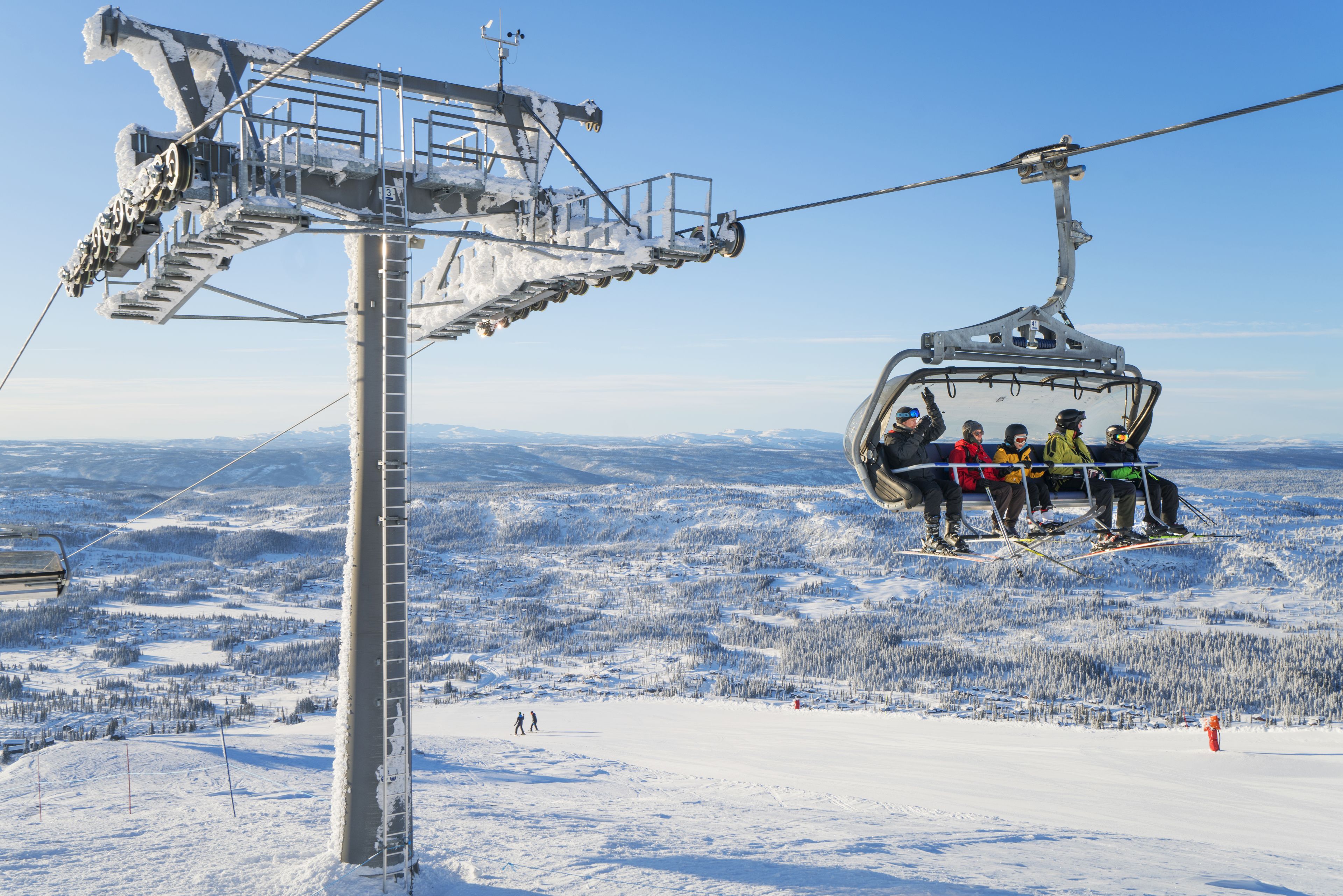 A ski lift with passengers.