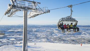 A ski lift with passengers.