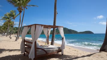 On the beach, white sand, free beach cabanas, sun loungers