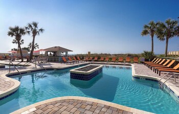 Indoor pool, 2 outdoor pools, pool umbrellas, sun loungers at Best Western Ocean Sands Beach Resort